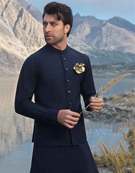 white shalwar kameez with blue waistcoat